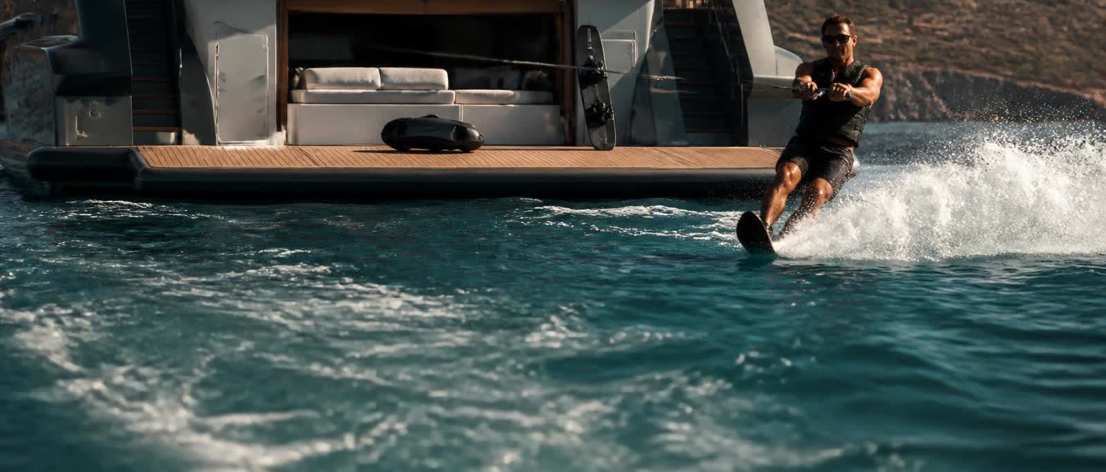 Water-skiing behind the yacht, with a wakeboard and Seabob on the swim platform